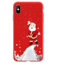 Christmas-themed painted back cover case for iPhone on a wooden table.