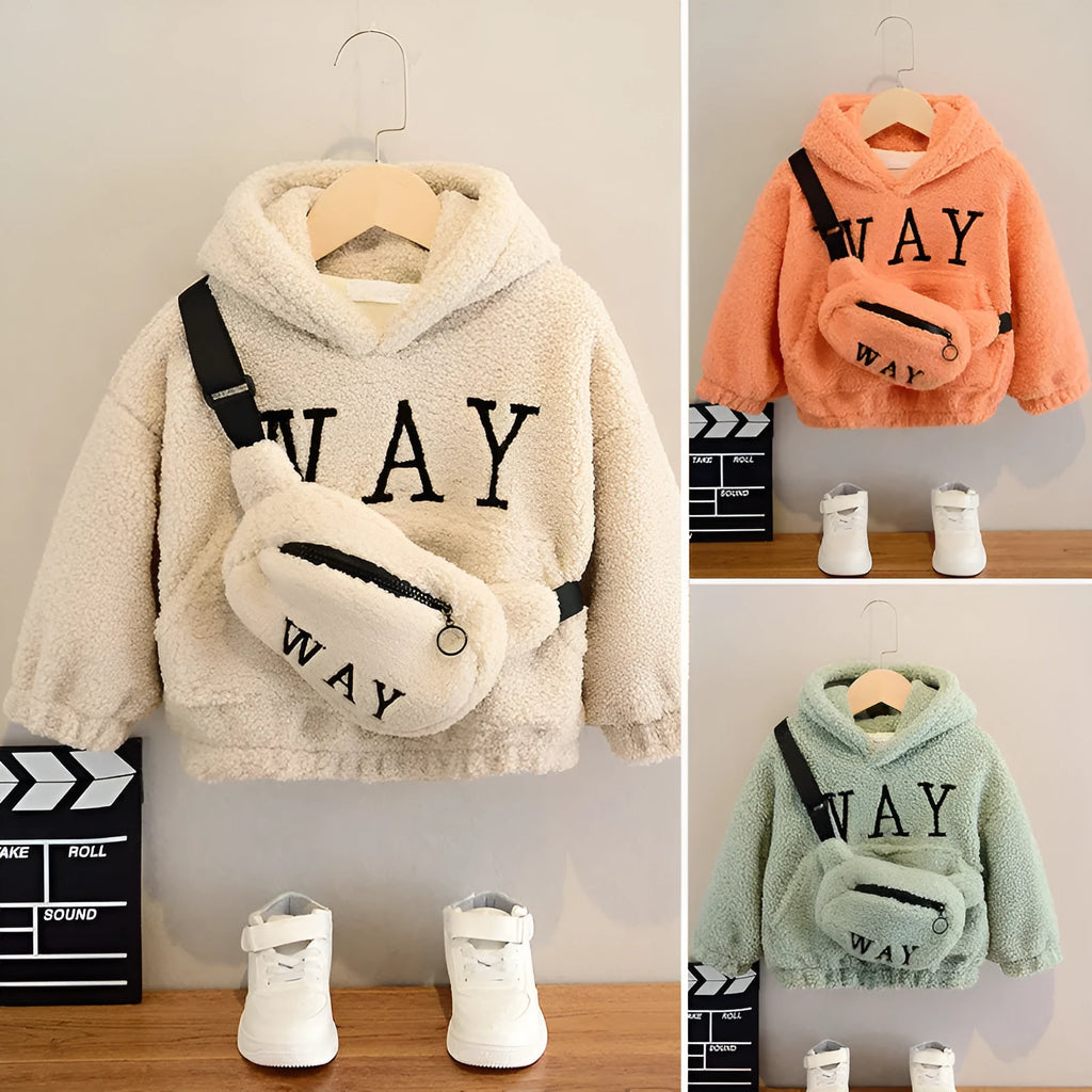Child wearing a beige fleece hooded jacket with a cartoon print and long sleeves.