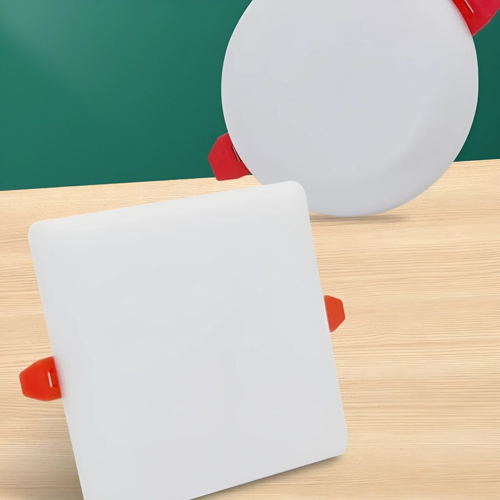 Ultra-thin square and circular LED panel lights with adjustable mounting tubes on a white ceiling.
