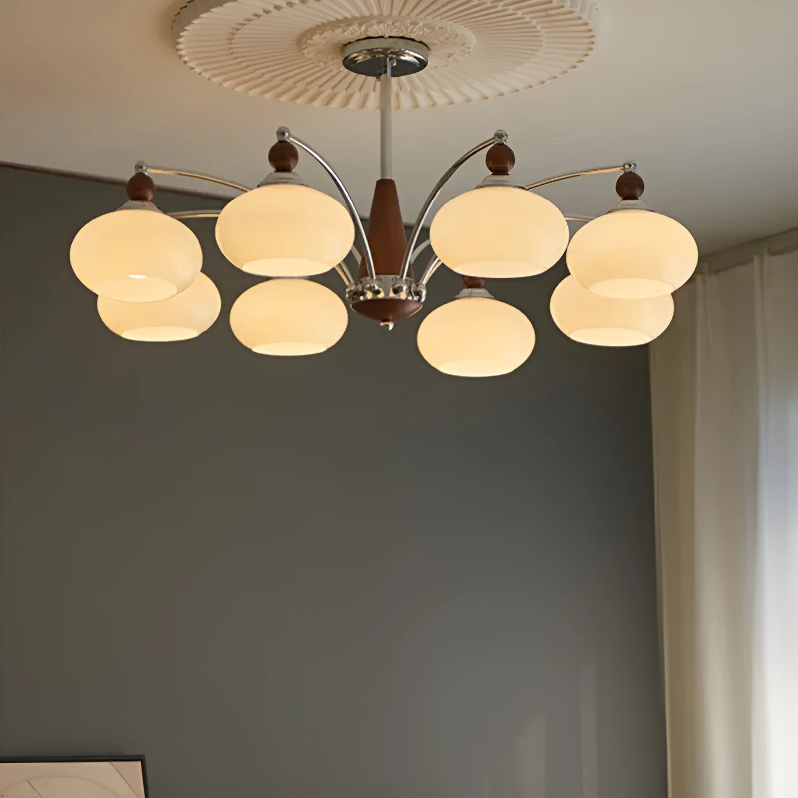 Persimmon glass chandelier with chrome and white lampshades in a middle ancient style