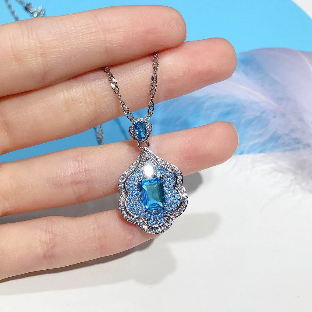 Sea blue geometric copper pendant charm with aquamarine topaz colour for DIY jewellery
