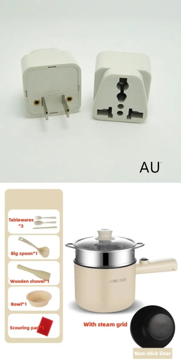 White and green mini electric hot pot cooker with stainless steel body and cooking accessories on a kitchen counter.