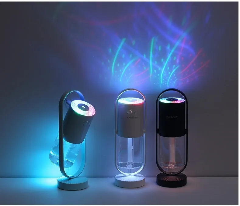 Pink USB portable air humidifier with projection night light on a wooden desk