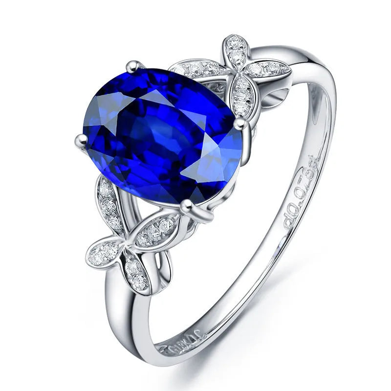 Women's 18k rose gold plated copper butterfly ring in a heart shape, shown in red and blue colour options.