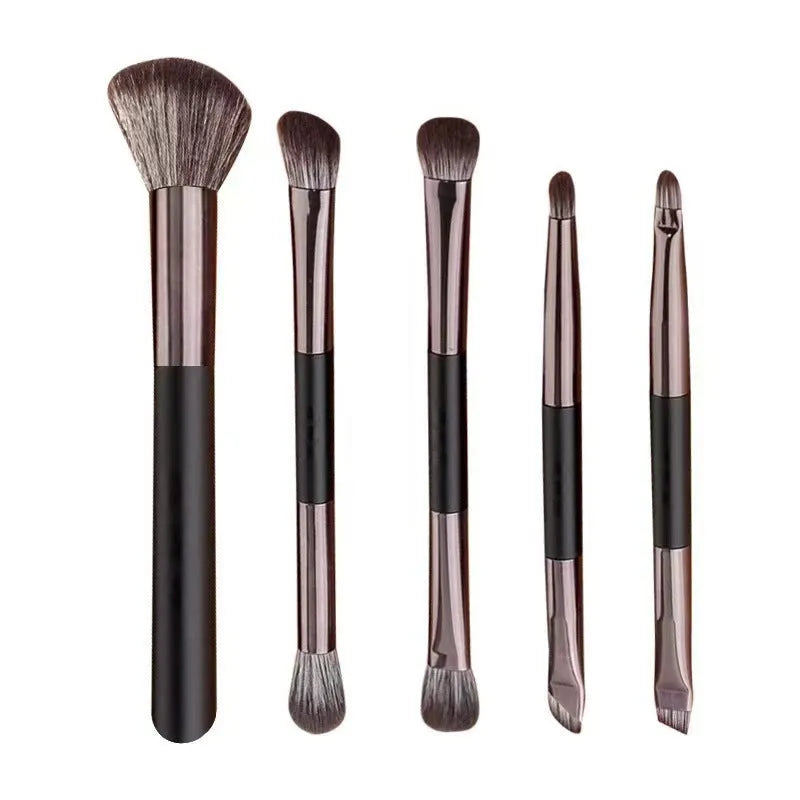 Portable makeup brush set with mirror showing artificial fibre brush heads and silver/gold plastic handles