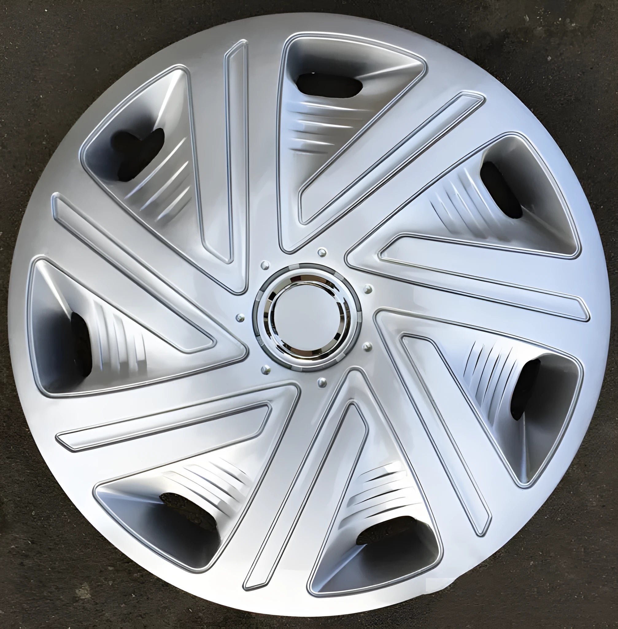 Universal ABS plastic wheel hub cover in a monochrome finish, shown against a car wheel.