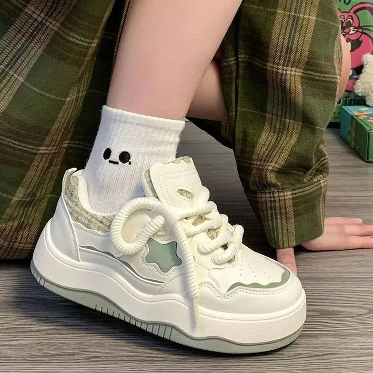 Women's green and pink artificial PU platform sneaker with front lace-up and round toe.