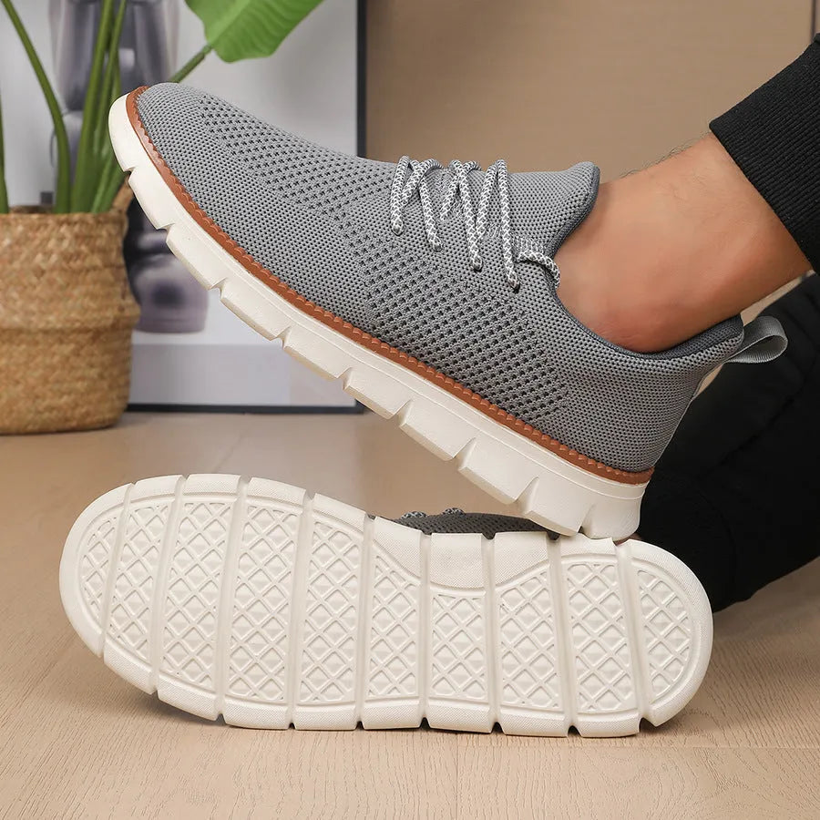 Men's grey and black fly woven mesh sneakers with round toe and low-heel design