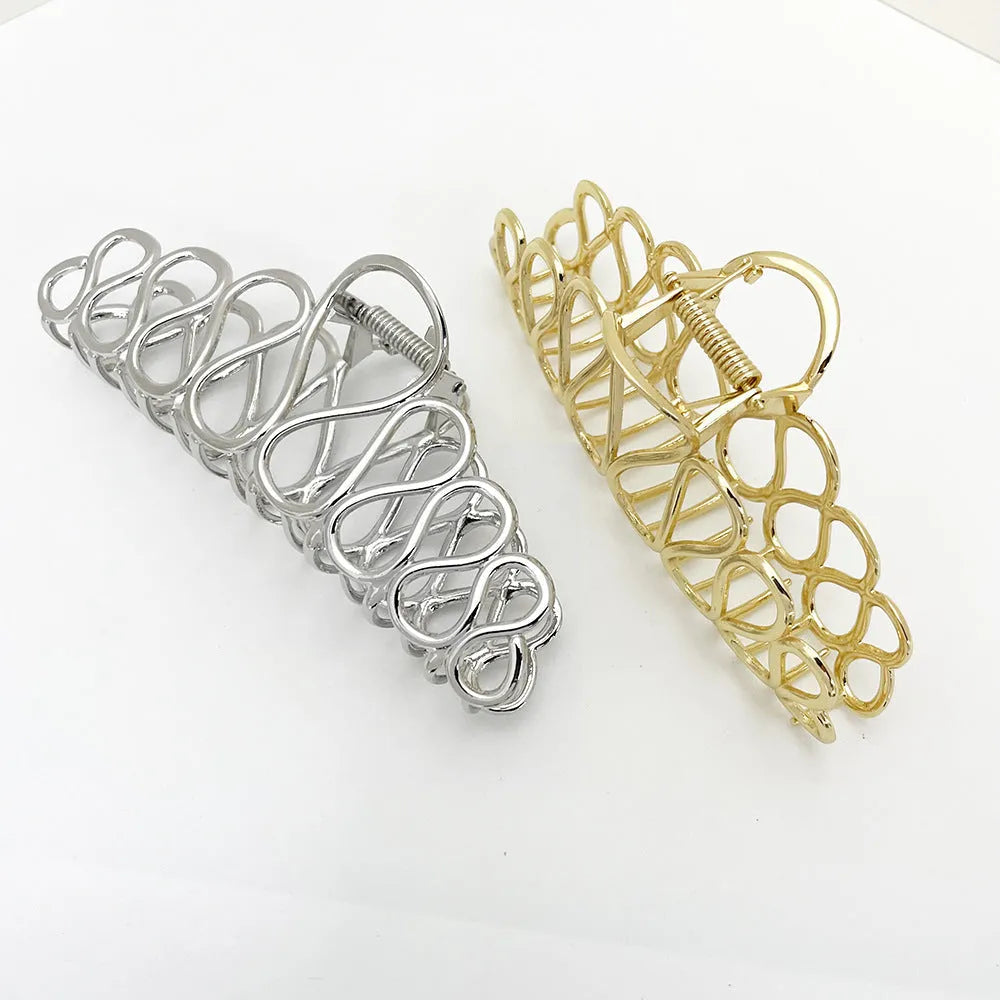 Minimalist large alloy hair clip with tassel in gold or silver for updo hairstyles.