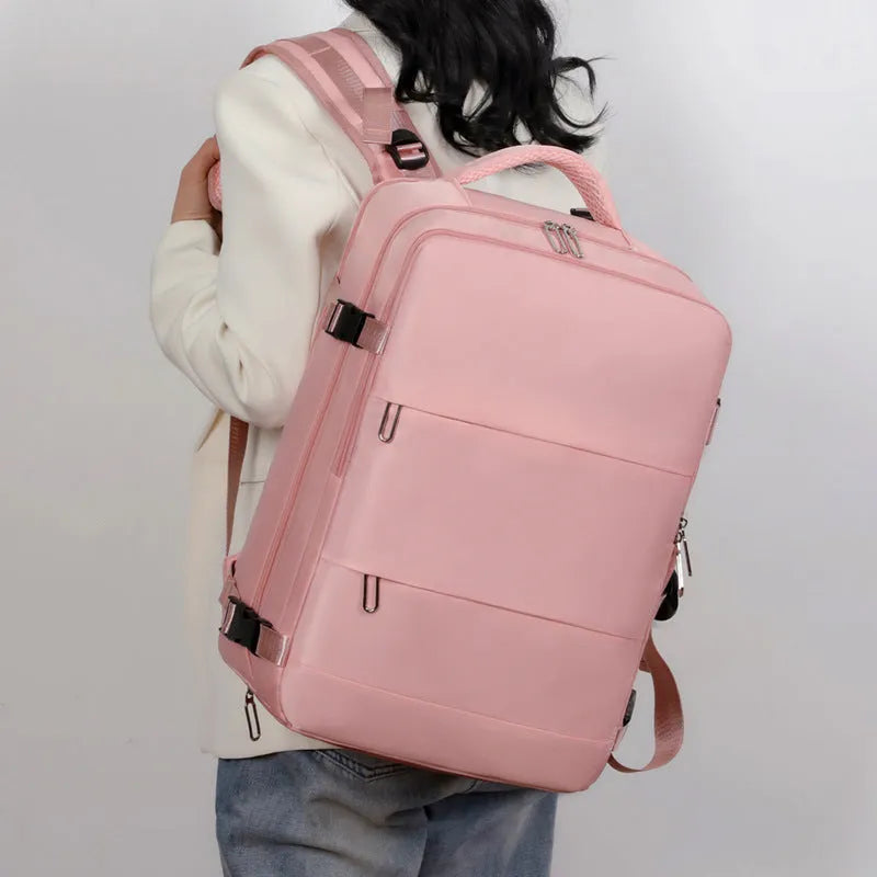 Large travel backpack with multiple compartments in purple, grey, black, or pink colours showing organisational pockets