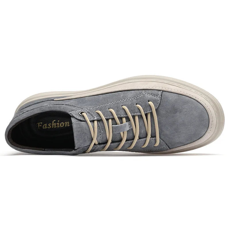Men's grey casual skate shoes with pigskin upper and rubber sole showing lace-up front and round toe design