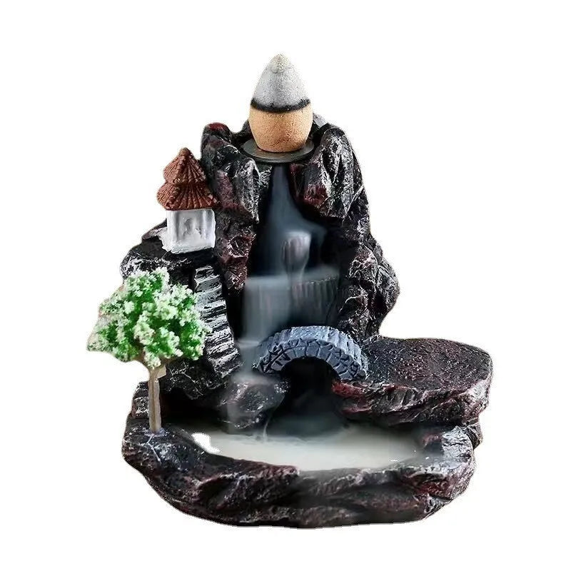 Modern ceramic backflow incense burner with sandal ornament in green tree design.