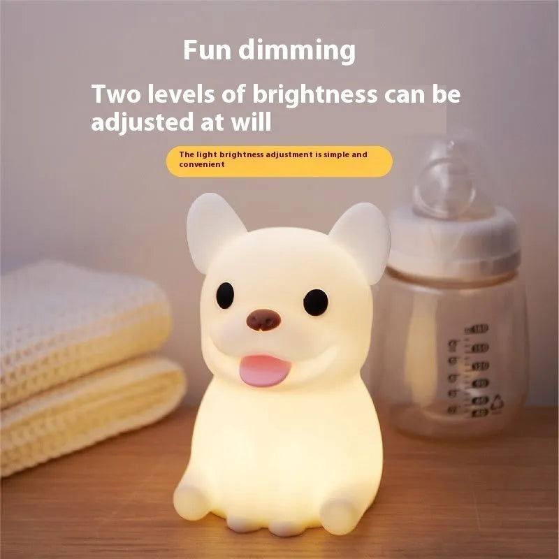 Silicone cartoon bull night light with USB port for charging and dimming controls.