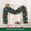 Pink rattan Christmas vine decoration with small fruit ornaments, 2.7 metres long, on a wall display