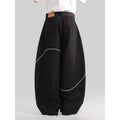 Black straight-leg denim trousers with mid-waist and zip placket on hanger showing micro-elastic polyester fabric