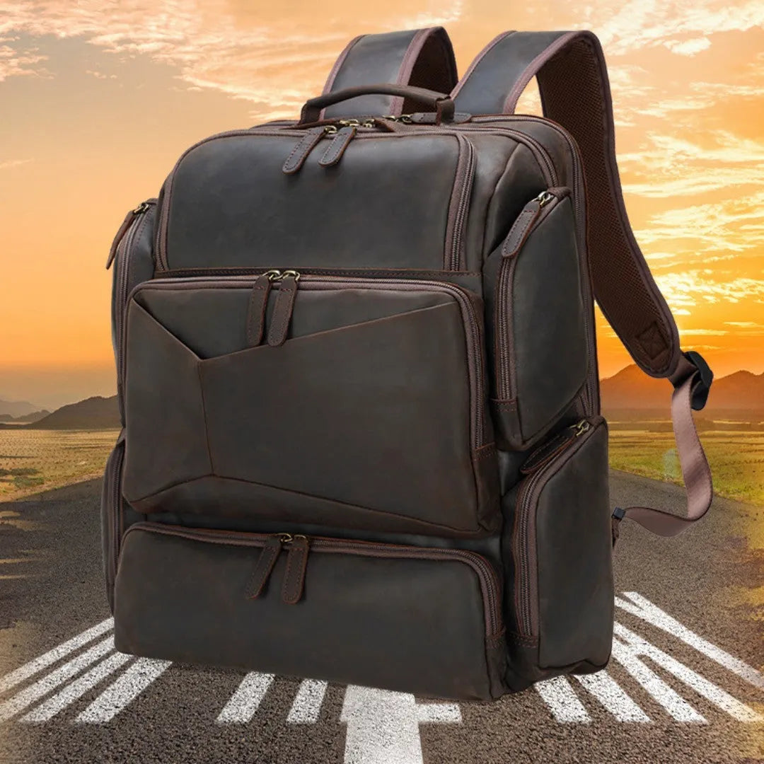Dark brown genuine cowhide leather backpack with double shoulder straps and organisational compartments for 17-inch laptop
