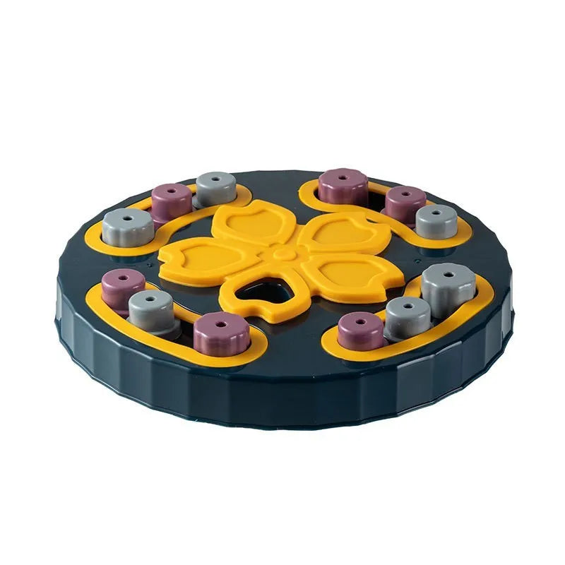 Blue silicone dog slow feeder mat with puzzle grooves and a suction base on a kitchen floor.