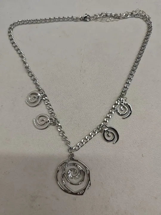 Spiral donut jewellery set with necklace, bracelet, and earrings in gold electroplated alloy