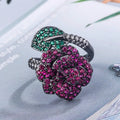 Geometric flower ring with black gold plating and red corundum stone