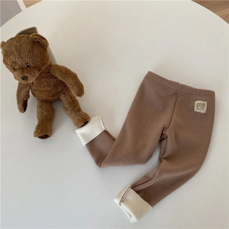 Girls' high-waist fleece-lined leggings in beige, black, brown, or grey colour.