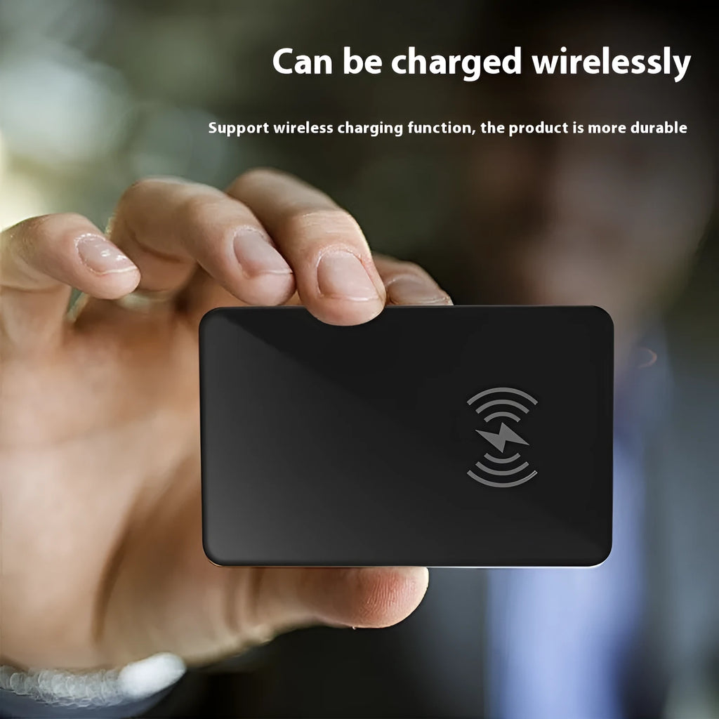 Black credit card sized pet tracker with a hanging hole, showing wireless charging and NFC symbols.
