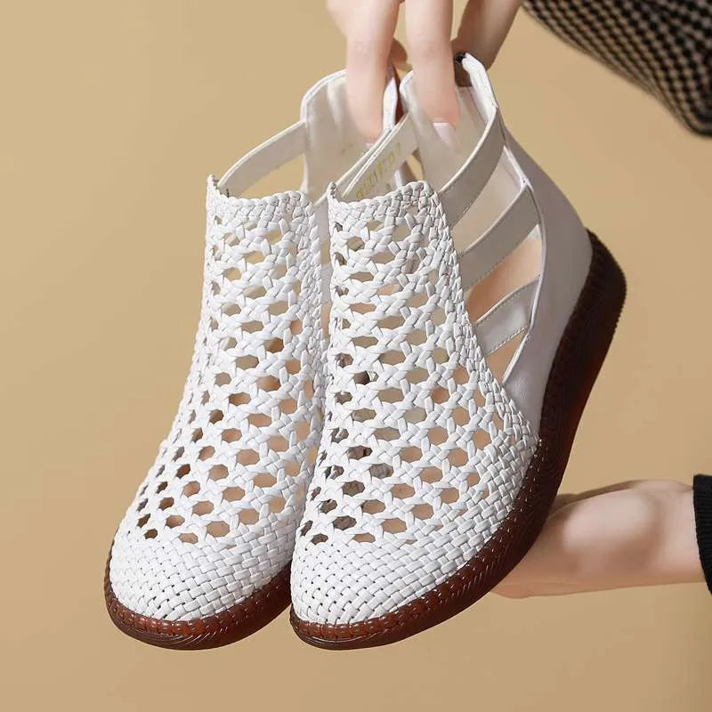 Women's flat sandals with hollow-out design in gold colour showing soft TPR soles and oversleeve style