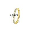 Stainless steel seamless nose ring with diamond detailing in gold finish, showing round shape and smooth surface