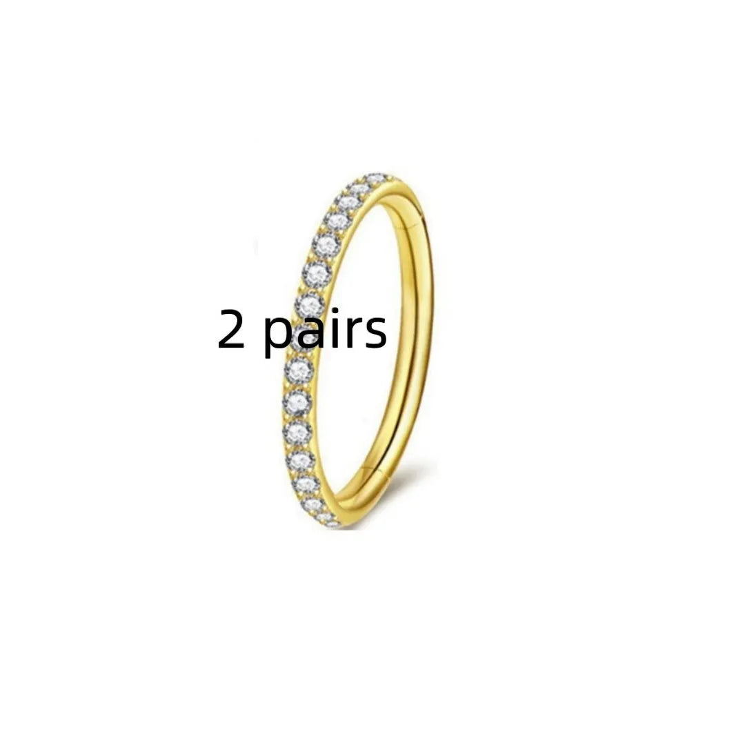 Stainless steel seamless nose ring with diamond detailing in gold finish, showing round shape and smooth surface