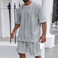Knitted jacquard summer casual set with round neck pullover top and matching shorts in light grey colour