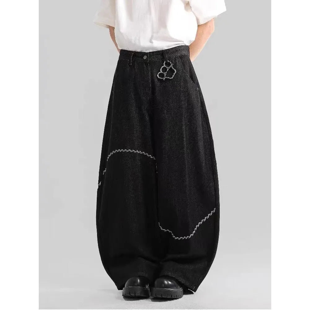 Black straight-leg denim trousers with mid-waist and zip placket on hanger showing micro-elastic polyester fabric