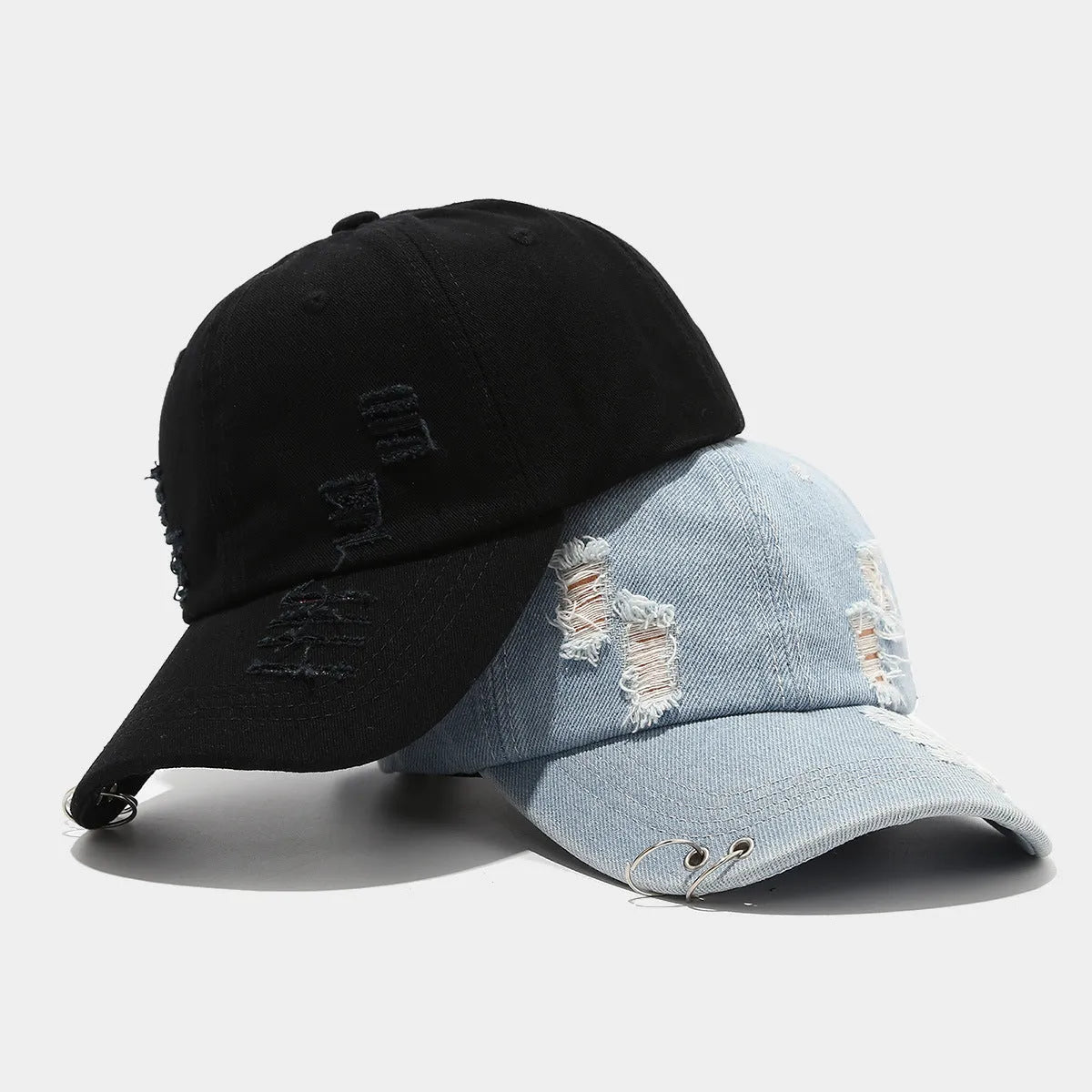 Men's adjustable cotton denim peaked cap in black showing dome crown and peaked brim design