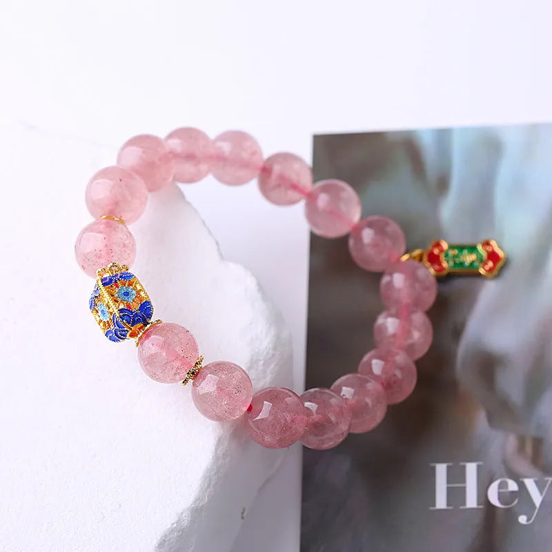 Pink strawberry quartz crystal bracelet with Chinese Ruyi symbols and hand-woven beaded design for women
