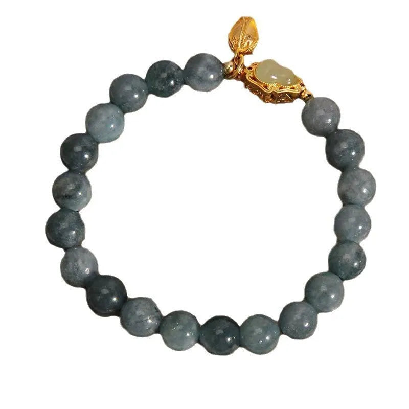 Sky blue natural stone bracelet with carved lotus and gourd pendant on electroplated brass setting
