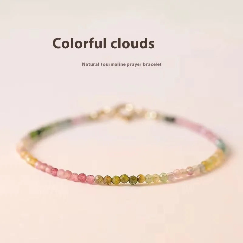 Handmade women's rainbow fluorite bracelet with copper geometric settings