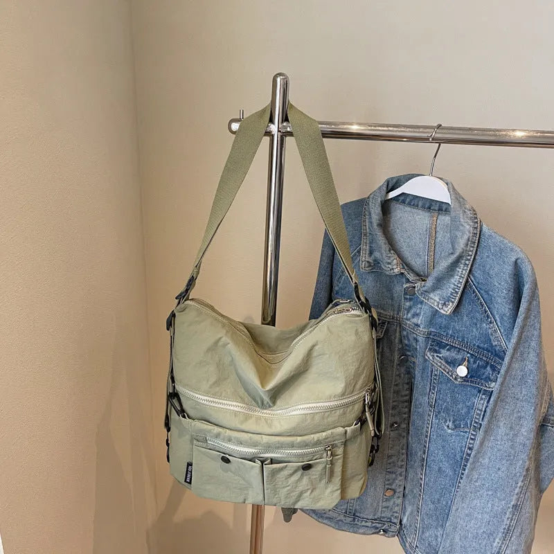 Women's soft nylon crossbody bag with sandwich zipper pocket and adjustable shoulder straps