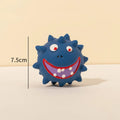 Four colourful squeaky dog balls with cute faces, showing textured surface for dental cleaning, natural latex construction