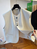 Beige loose-fitting waistcoat dress with side pockets, 40cm length, shown on mannequin