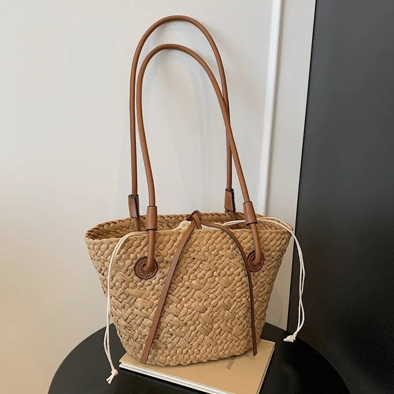 Large woven shoulder hand-carry bag in retro styling with horizontal square shape