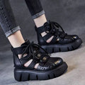 Women's black platform sandals with fish mouth toe and hollow hole design on plush upper