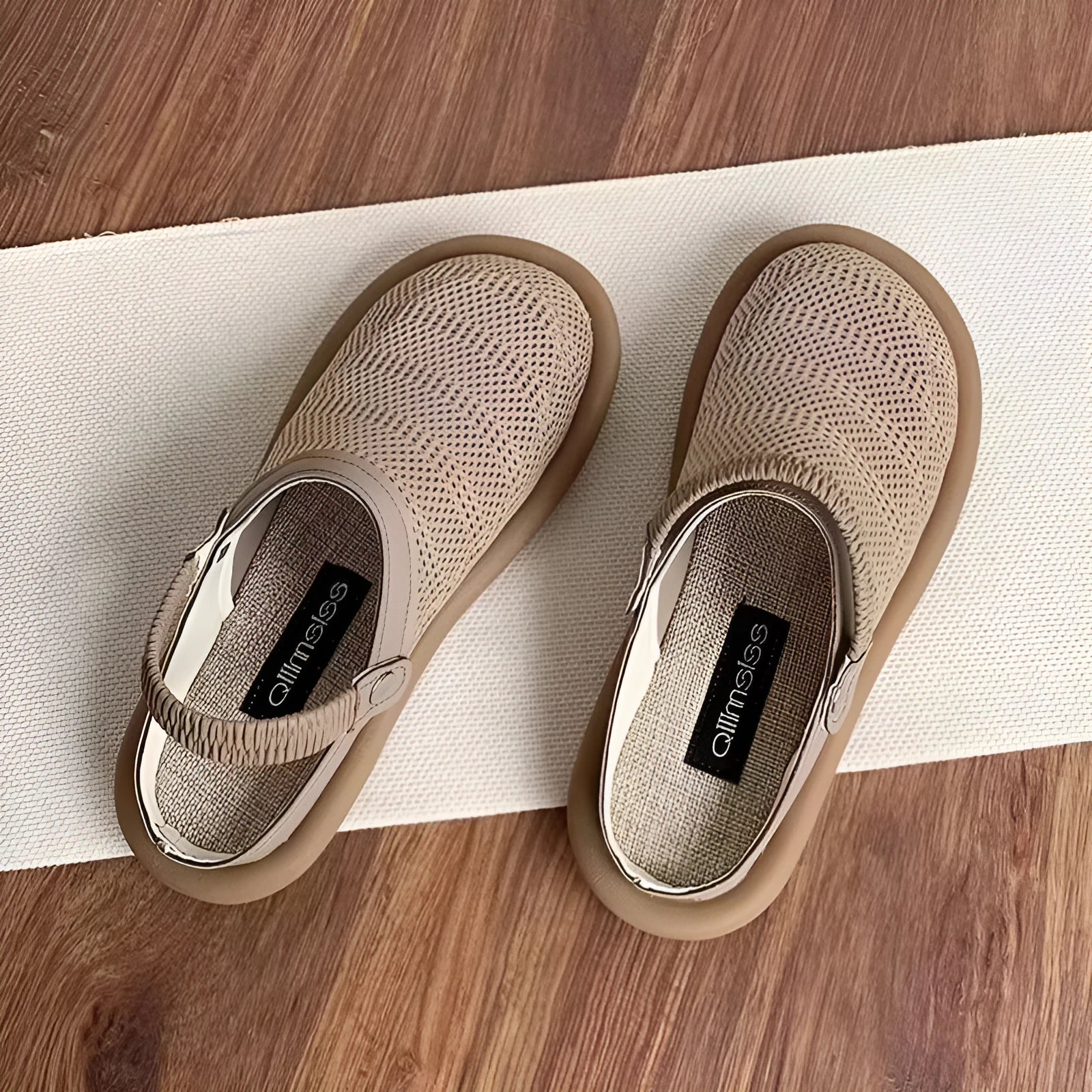 Milky white linen slip-on shoes with mesh lining, round toe, and a light rubber sole on a neutral background.