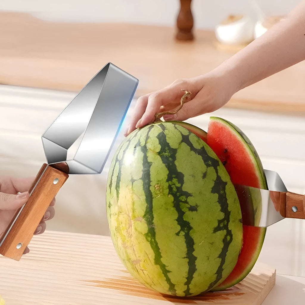 A stainless steel watermelon splitter with triangular blades and a red protective cover on a kitchen worktop.