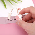 Creative cartoon metal pendant book holder with cherry blossom cat design for journal decoration.