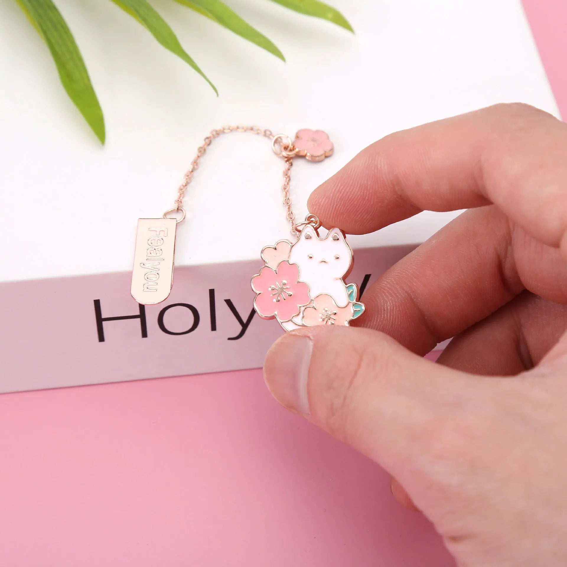 Creative cartoon metal pendant book holder with cherry blossom cat design for journal decoration.