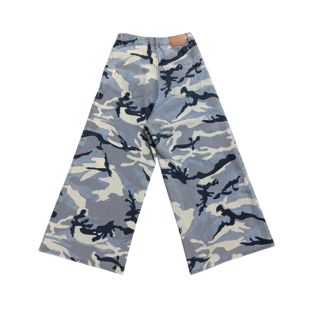 Snow camouflage blue jeans with loose fit and mid-waist design on a hanger