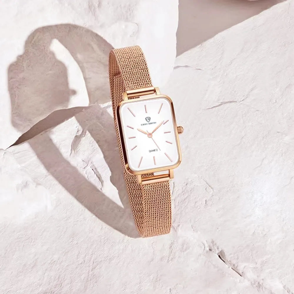 Women's waterproof quartz watch with rose gold finish, showing 34mm alloy case and woven steel strap