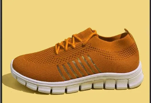 Women's breathable platform sneakers in multiple colours on a white background, showing lace-up front and flat rubber sole.