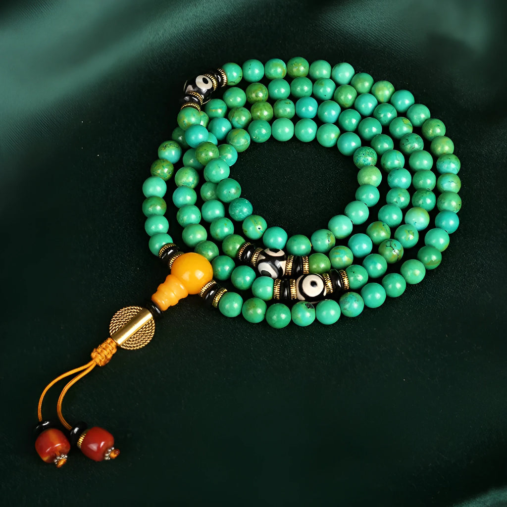 Natural turquoise gemstone bracelet with 108 round polished beads on a string.
