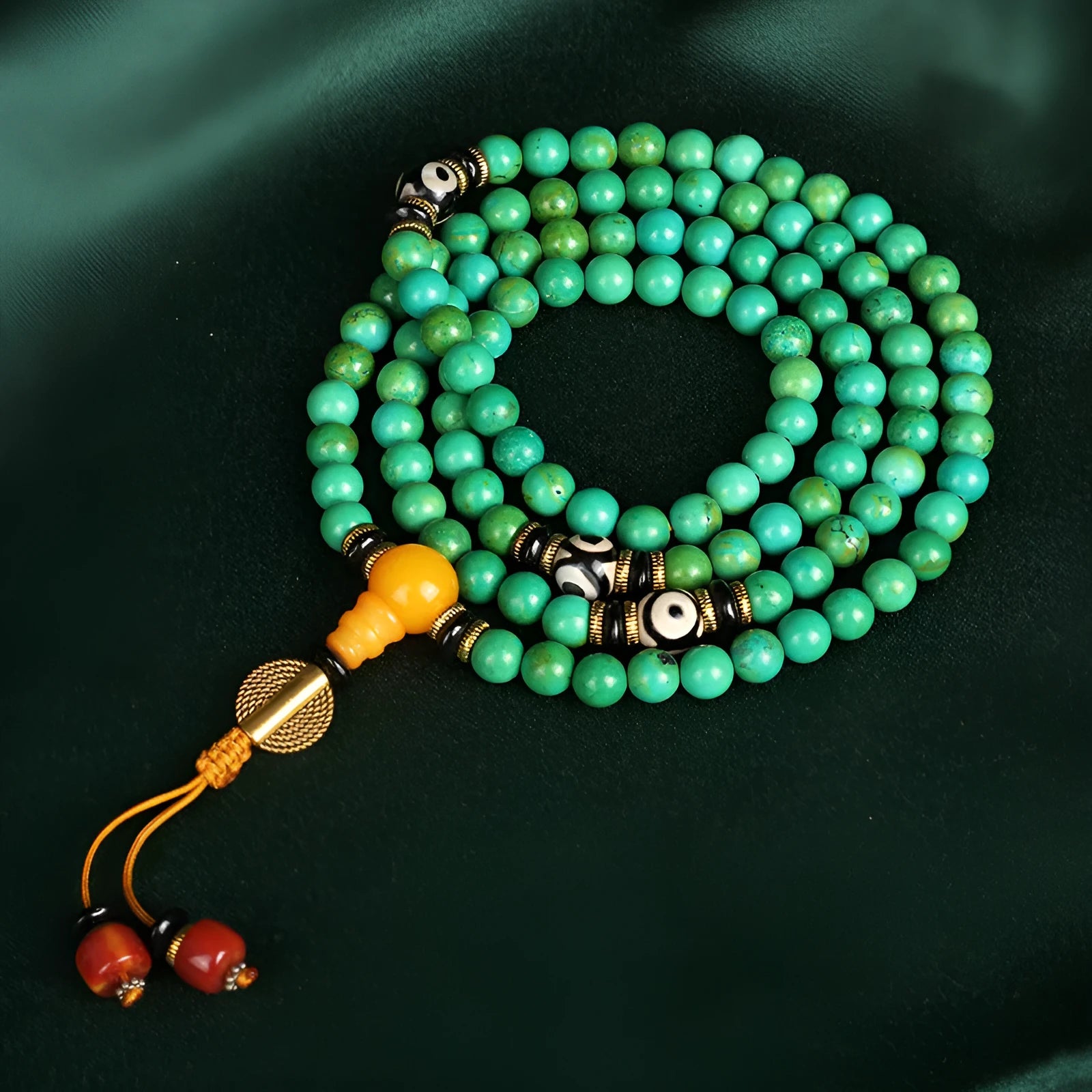 Natural turquoise gemstone bracelet with 108 round polished beads on a string.
