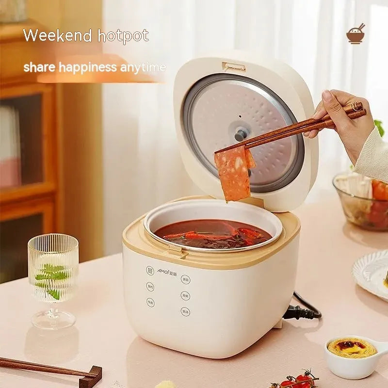 White and beige plastic multi-function 3-litre rice cooker with black inner pot and accessories.