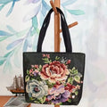 Gold wire embroidered canvas handbag showing bunny design, with polyester lining and top handles.